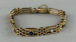Jewellery: Yellow metal three bar gate bracelet set with three 4mm circular-cut sapphires alternatin