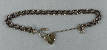 Jewellery: a 9ct gold curb link bracelet with replacement heart clasp, c.18cm, 12.7g.