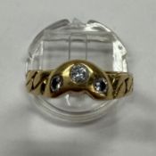 Jewellery: 18ct gold wishbone-style ring set with three brilliant-cut diamonds, estimated weight of 