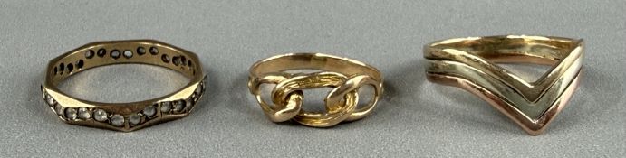 Jewellery: a 9ct three colour gold wishbone ring, UK size M; a 9ct gold full eternity ring set white