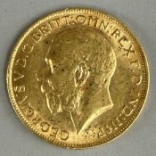 Coins: a 1912 George V gold full sovereign, circulated.
