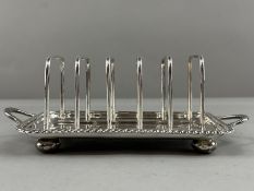 Silver: a five slot toastrack by Thomas Bradbury, London 1892, with squared dividers and an integral