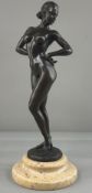 Decorative Arts: an Art Deco style bronze of a standing nude female upon marble base, signed Ray Mon