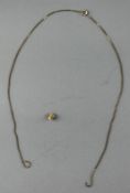 Jewellery: a broken 9ct gold box chain, 2.0g, together with a yellow metal watch winder.