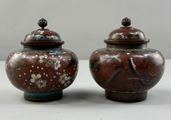 Oriental: a pair of late Meiji Japanese cloisonne lidded jars with pierced finials, a terracotta ena