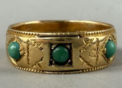 Jewellery: a late Victorian 18ct gold ring set with three cabochon turquoise within an engraved grou