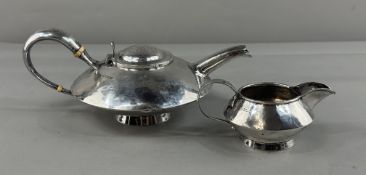 Silver: an Arts and Crafts style planished teapot by John Round, Sheffield 1905, of broad conical fo