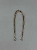 Jewellery: a 9ct rose gold graduated curb link bracelet with replacement yellow gold clasp, 20.5cm, 