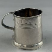 Silver; an early 18th century Queen Anne small mug or christening cup of tapering plain form, with s