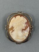 Jewellery: a 9ct gold mounted cameo brooch, Birmingham 1976, the shell carved with the image of a yo