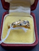 Jewellery: 18ct gold crossover boat-shaped ring with three sapphires and interspaced by two diamonds