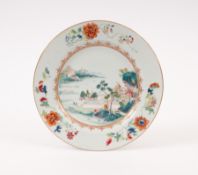 A Chinese famille rose plate, Qianlong 1736-95, painted with figures on a bridge within an extensive