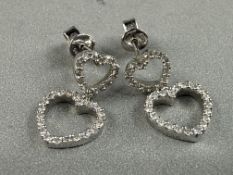Jewellery: Pair of white metal heart-shaped drop earrings set with eight-cut diamonds, surface tests