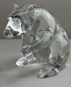 Glassware: a simplistic glass polar bear by Baccarat, modelled in a seated position with front paws 