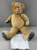 Toys: a mid century articulated teddy bear, no labels, with dark blue cloth pads, replacement eyes a