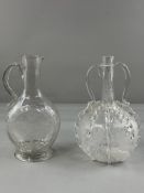 Two Continental glass carafes, 18th century, one German, the flattened form engraved with sunflowers