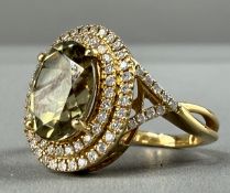 Jewellery: a yellow metal cluster ring, marked 18K and testing as gold, a central turkizite of appro