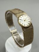 Watches: a ladies 9ct gold cased Omega wristwatch with integral mesh strap, London 1965, CAL 620 mov