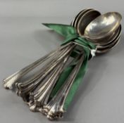 Silver: a set of nine Onslow pattern dessert spoons by Barker Brothers Ltd, each hallmarked for Birm