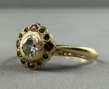 Jewellery: an early 20th century yellow metal flower head ring, marked 18ct and testing as gold, a c