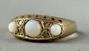 Jewellery: an 18ct yellow gold ring, Birmingham 1918, set with three graduated opals divided by pair