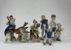 A group of Continental porcelain figures, 20th century, including a Sitzendorf figure of a boatman, 