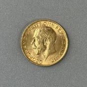 Coins: a 1912 George V full gold sovereign, circulated.