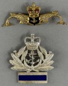 Militaria: a white metal brooch/badge worn by an officer in the W.R.N.S, a fouled anchor within a wr