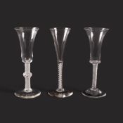 Two ale glasses and a toasting glass, c.1760, one ale with a waisted bucket bowl over a dense airtwi