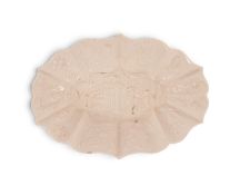 A salt-glazed stoneware spoon tray, c.1755, the deep lobed form moulded in relief with a Chinese fig