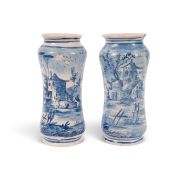 A pair of Savona maiolica albarelli, dated 1742, of tall waisted form, painted in blue with two figu