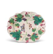 A deep Bow dish, c.1760, moulded and painted with fruiting grapevine branches, the well finely paint