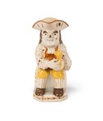 A Pratt ware Toby jug of possible Convict type, c.1790-1800, his jug of ale overflowing, wearing a p