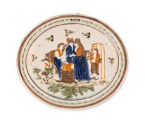A Pratt ware 'Gretna Green' plaque, c.1800-10, the oval form moulded and decorated with a blacksmith
