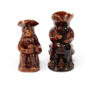 Two treacle-glazed Toby jugs, 19th century, one of a snuff taker, the other of Ordinary type, 24.5cm