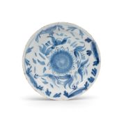 A small delftware plate, c.1720, possibly Bristol, painted in blue with a central sunflower, the rim