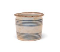 A delftware ointment or storage jar, c.1700, probably London, the cylindrical form painted with two 