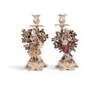 A pair of Chelsea candlestick figures, c.1762, modelled as a musical shepherd and his companion, sta