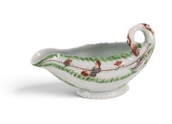 A Worcester cos leaf sauceboat, c.1755, formed of overlapping leaves with green, brown and puce deta