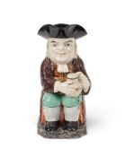A pearlware Toby jug, c.1795-1800, possibly Neale & Co, his foaming jug inscribed 'Mild Ale' wea