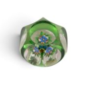 A St Louis faceted posy paperweight, 19th century, flashed in green and cut with six large ovals to 