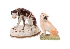 A Derby figure of a pug dog, early 19th century, seated with head turned to the left, on a grassy re