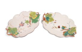 A near pair of Chelsea basket stands or dishes, c.1754-56, the wells painted with ladybirds and othe