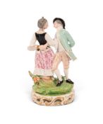 A Derby figure group of a dancing couple, c.1790-1800, with arms entwined around each other's backs,