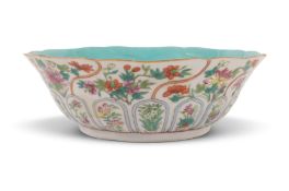 A Chinese famille rose lotus moulded bowl, six character Jiaqing seal mark and of the period 1796-18