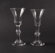Two baluster wine glasses, c.1740, one with a bell bowl raised on a plain stem with a central knop e