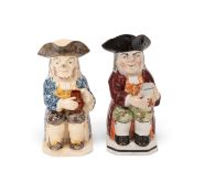 A creamware Toby jug of Ordinary type, c.1790-1800, decorated with a sponged blue coat and manganese