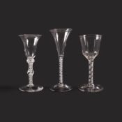 Three wine glasses, c.1755-65, one with a moulded round bowl over an airtwist stem and folded foot,