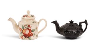 A small creamware teapot or saffron pot and cover, c.1800, the cylindrical form painted with red ros