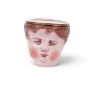 A rare English enamel figural bonbonnière, c.1770, modelled as the head of a sleeping child or putto
